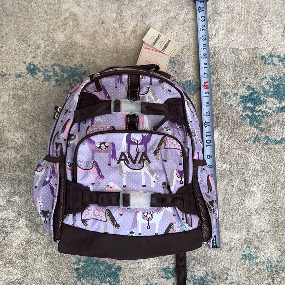 Pottery barn kids backpack with name AVA in brown embroidery.